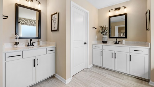 Bathroom with double vanity sink and extra sink.