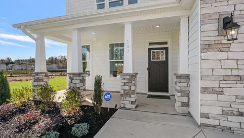 Front exterior of Hampshire with small patio.