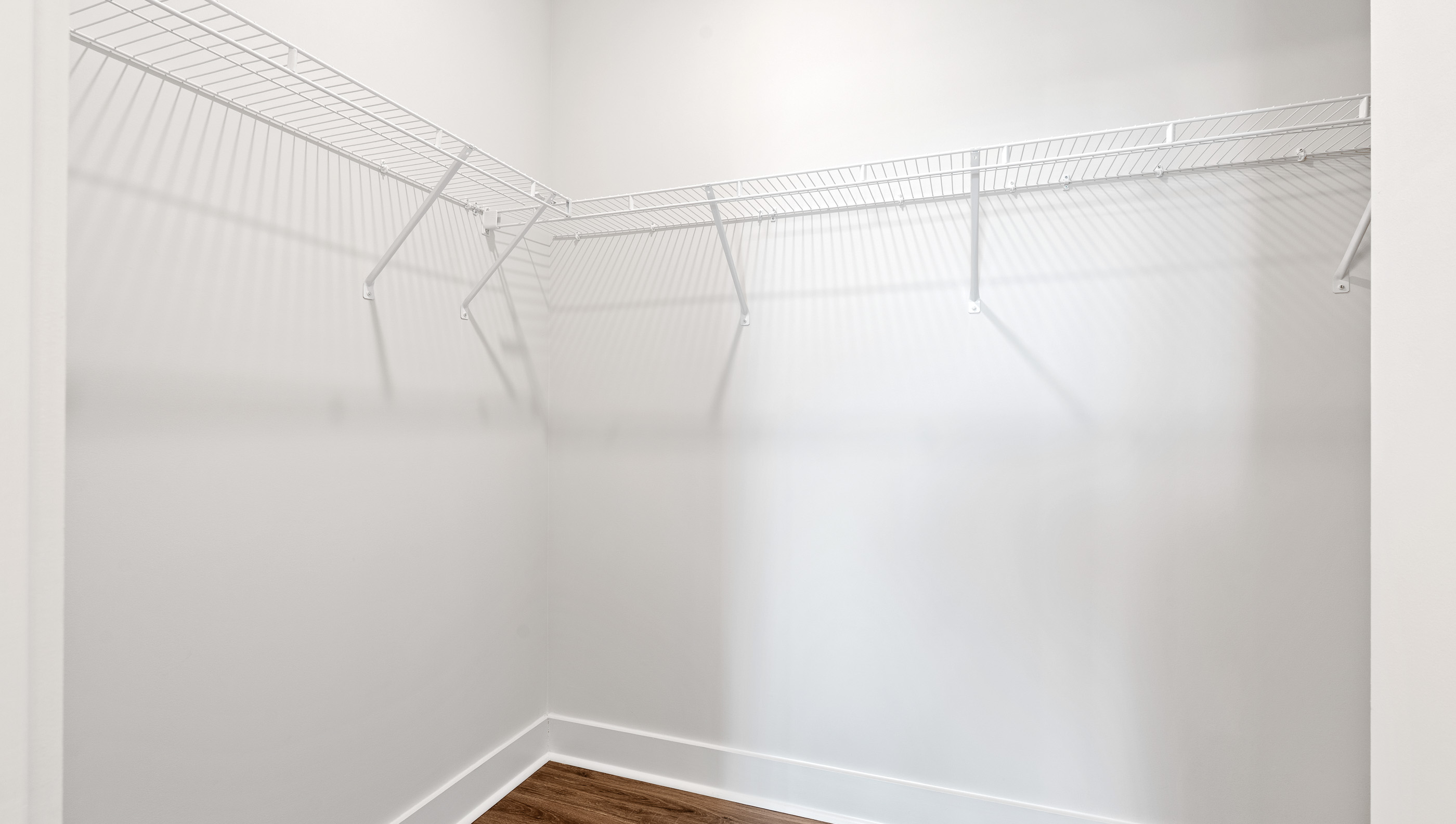 Primary bedroom walk-in closet.