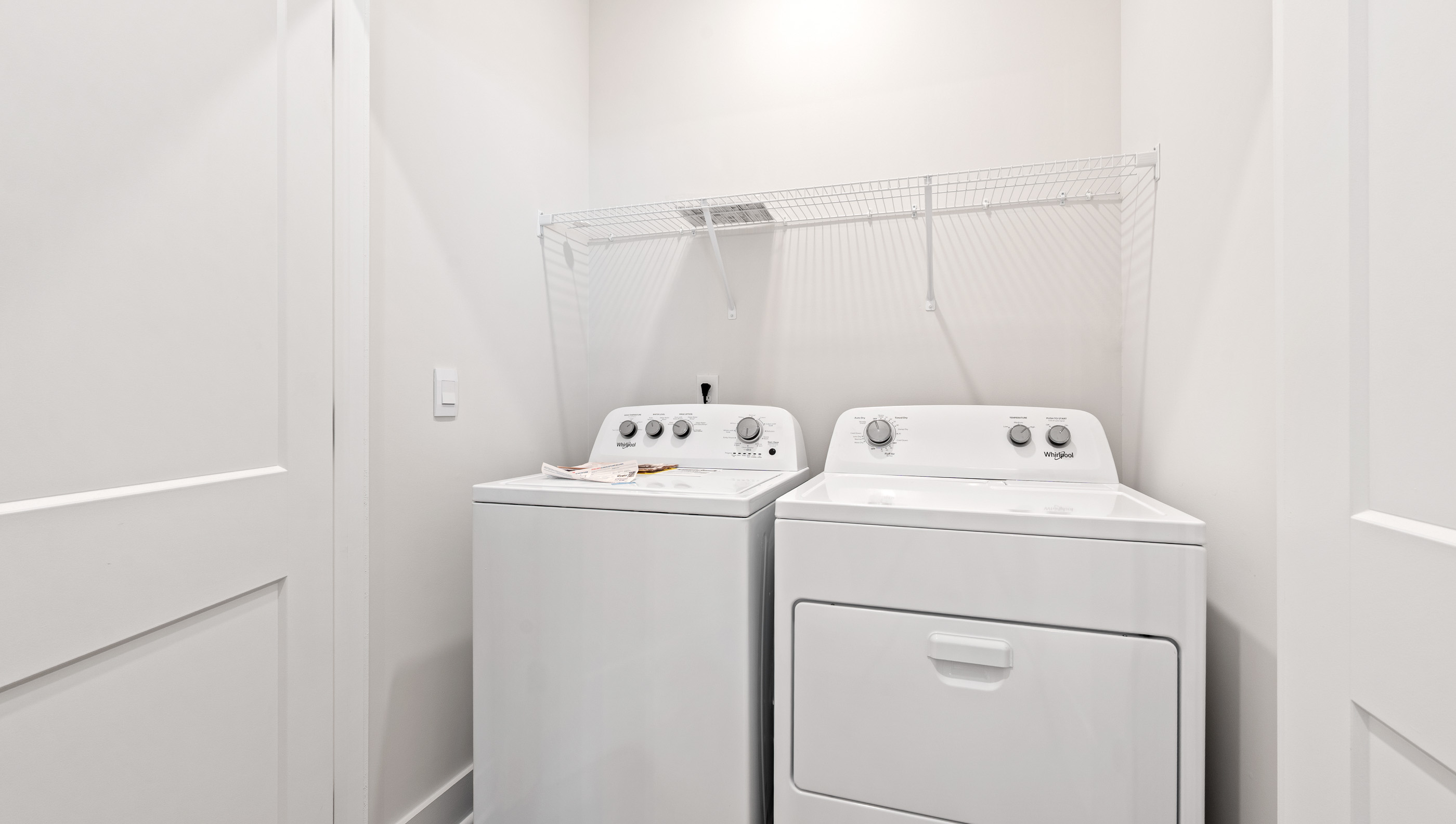 Laundry room with shelving.