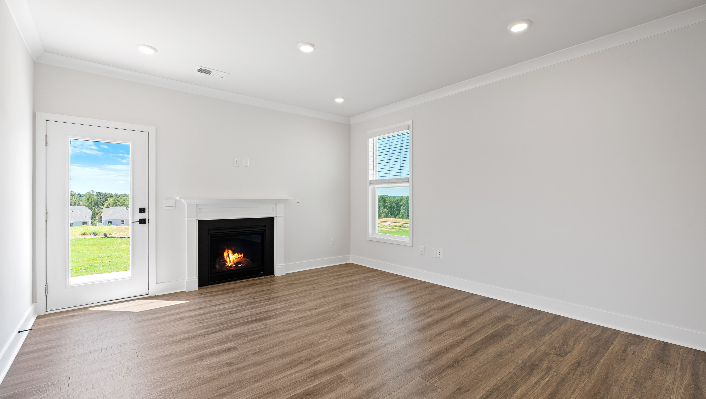 Living room with gas log fireplace.