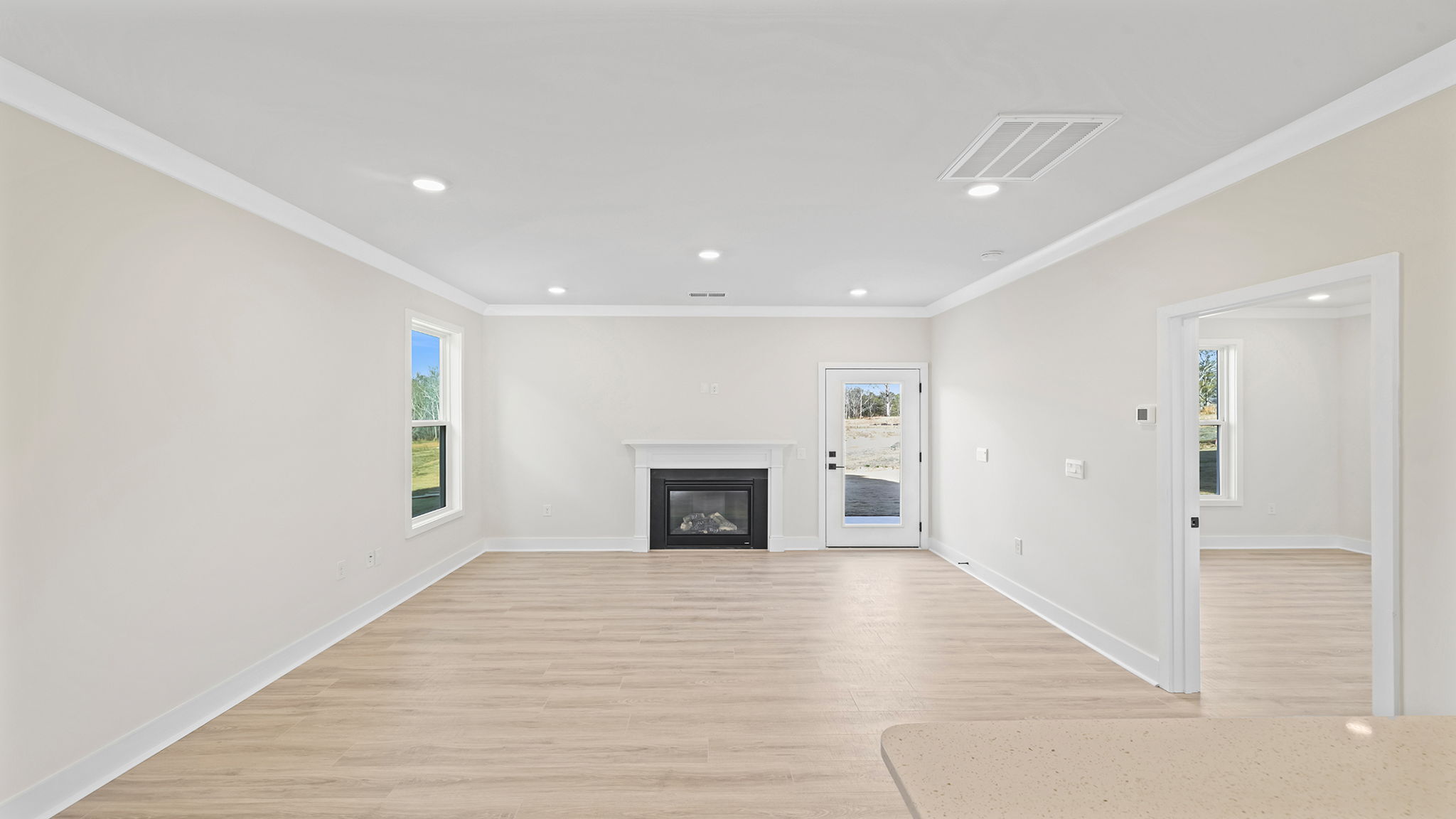 Living area with gas log fireplace.