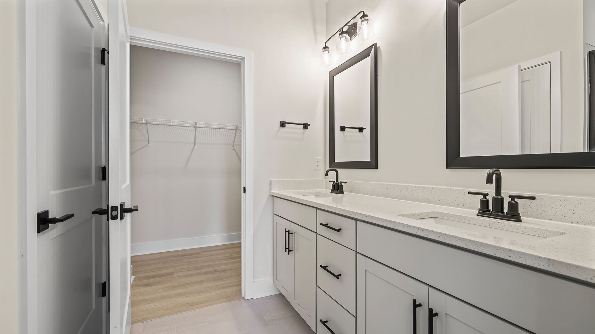 Primary bathroom with dual sink vanity.