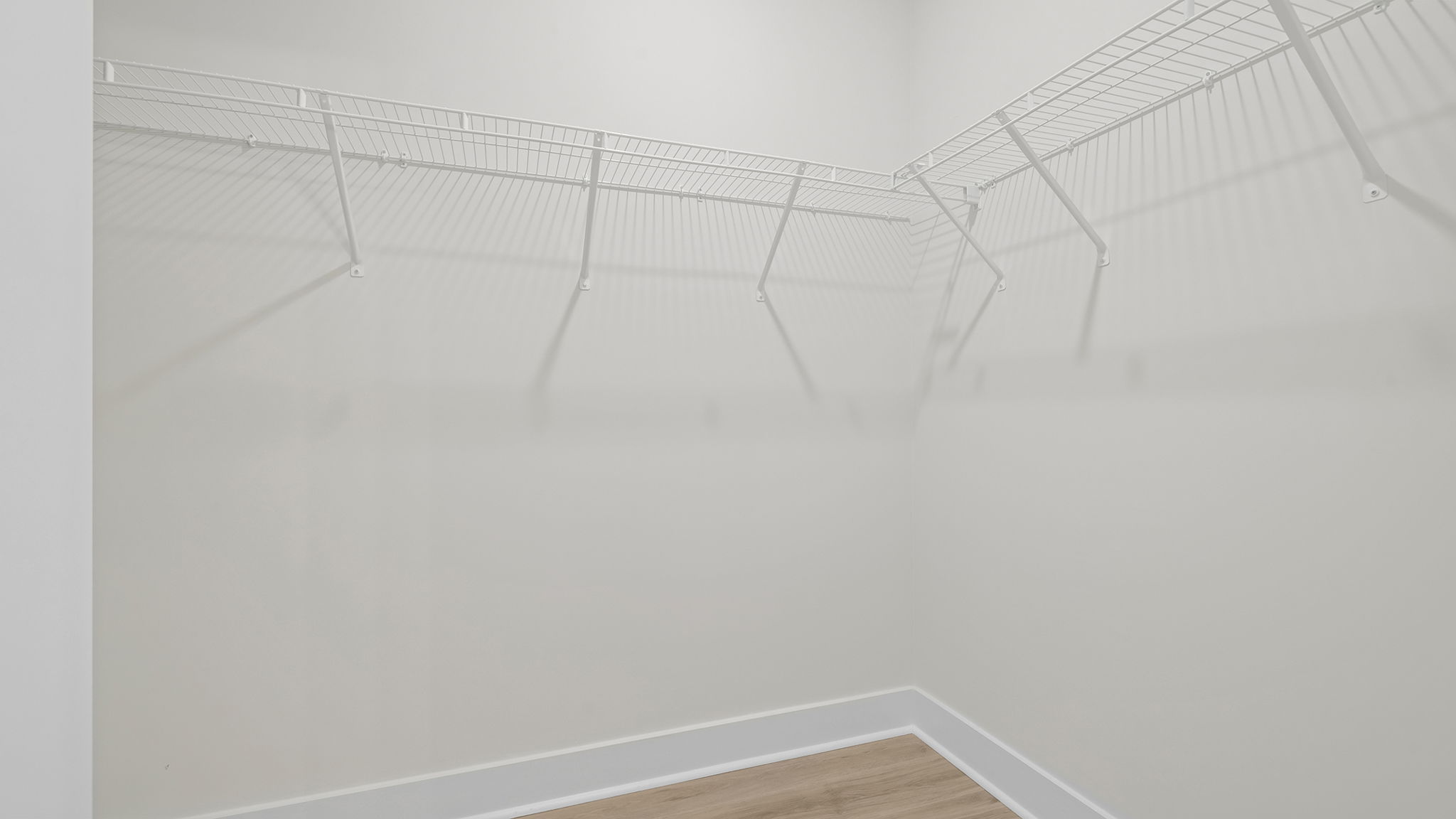 Primary bedroom walk-in closet.