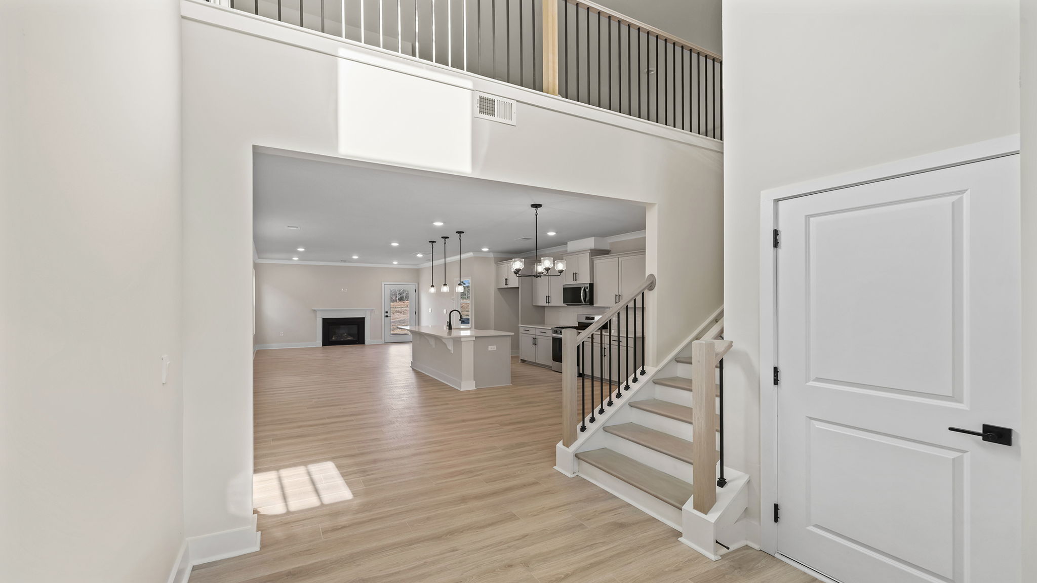 Two story foyer and view into the living area.