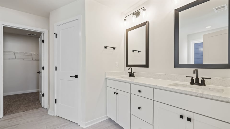 Primary bathroom with dual sink vanity.
