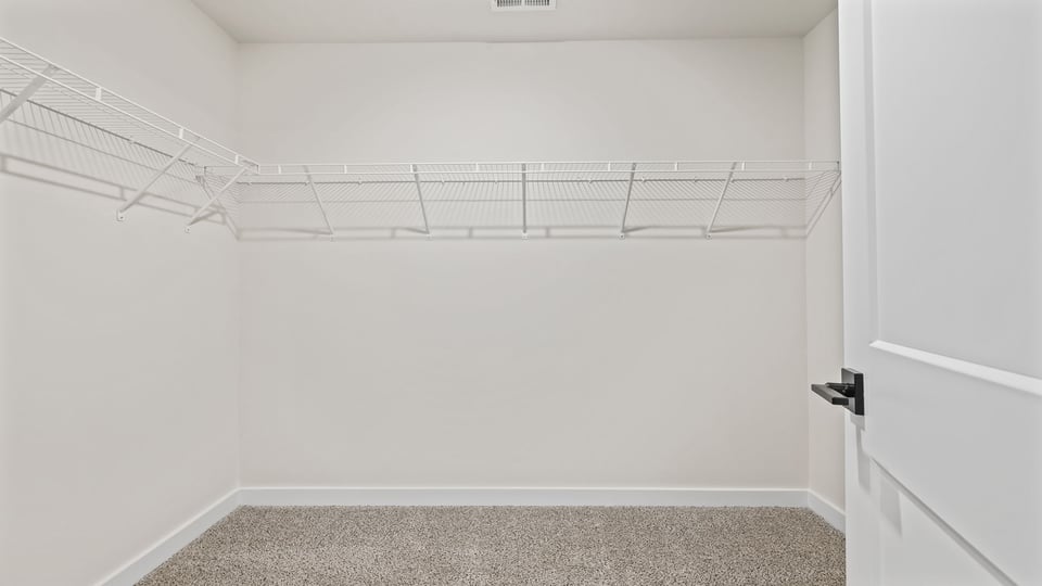 Primary bedroom walk-in closet.