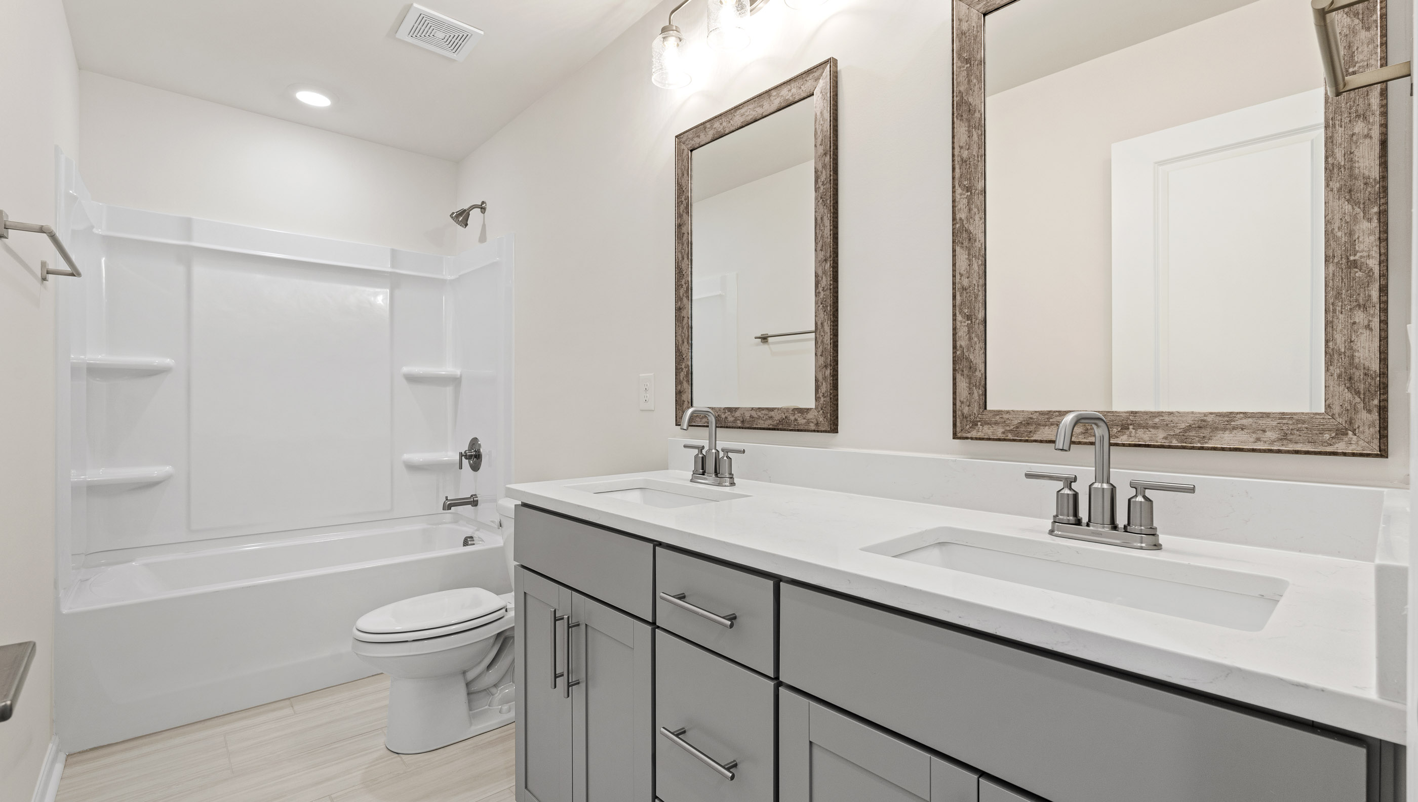 Bathroom with double vanity sinks.