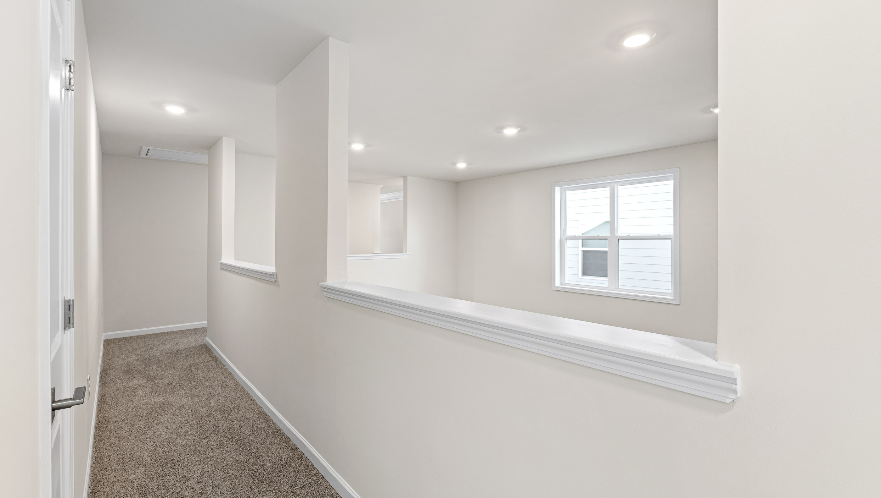 Top of stairs with carpet.