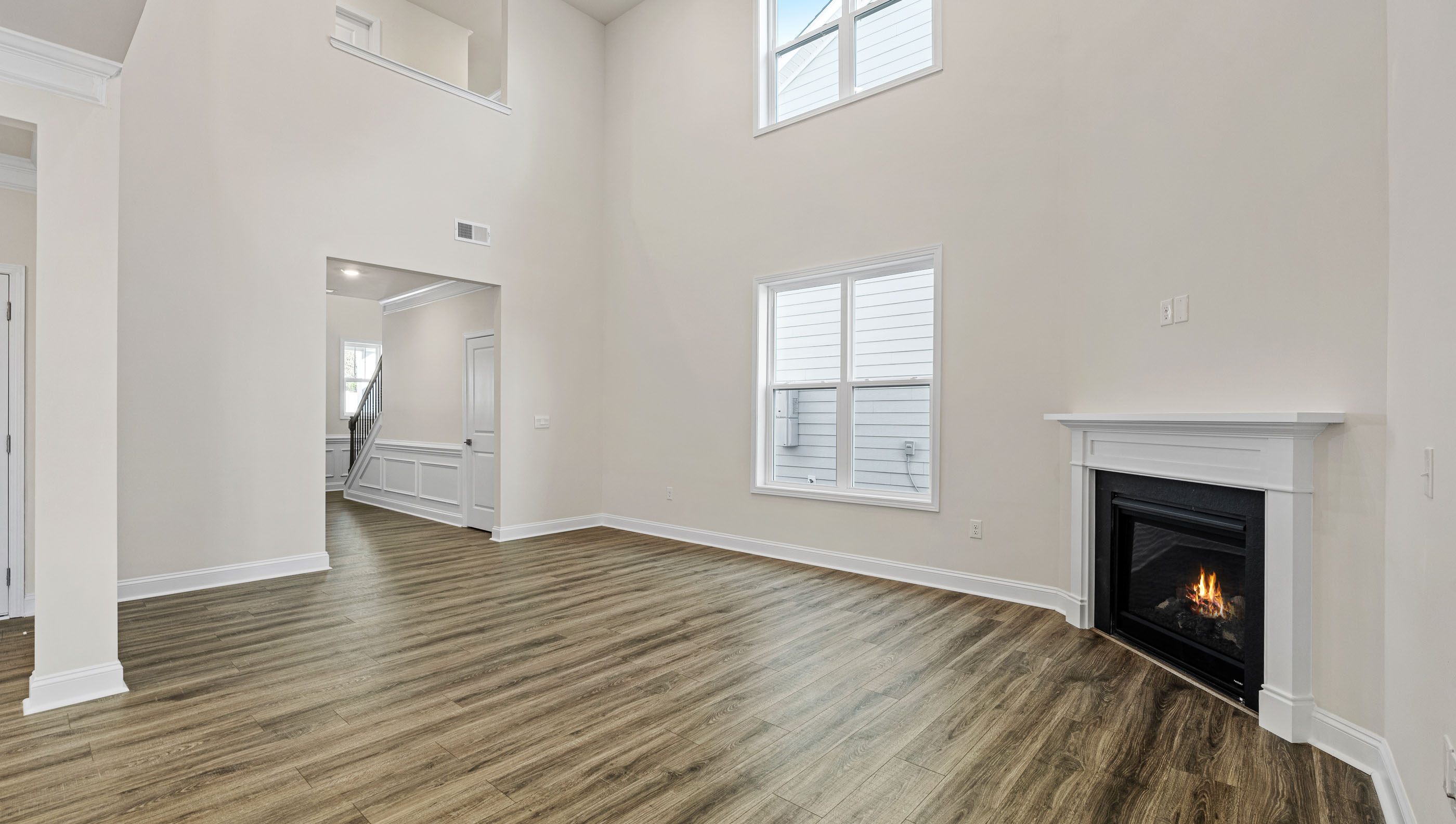 Living area with fireplace and windows.