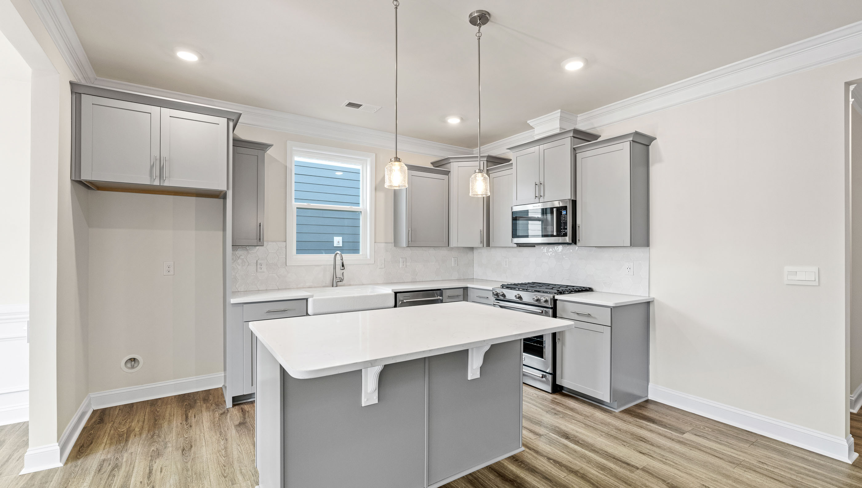 Kitchen with island and cabinets.