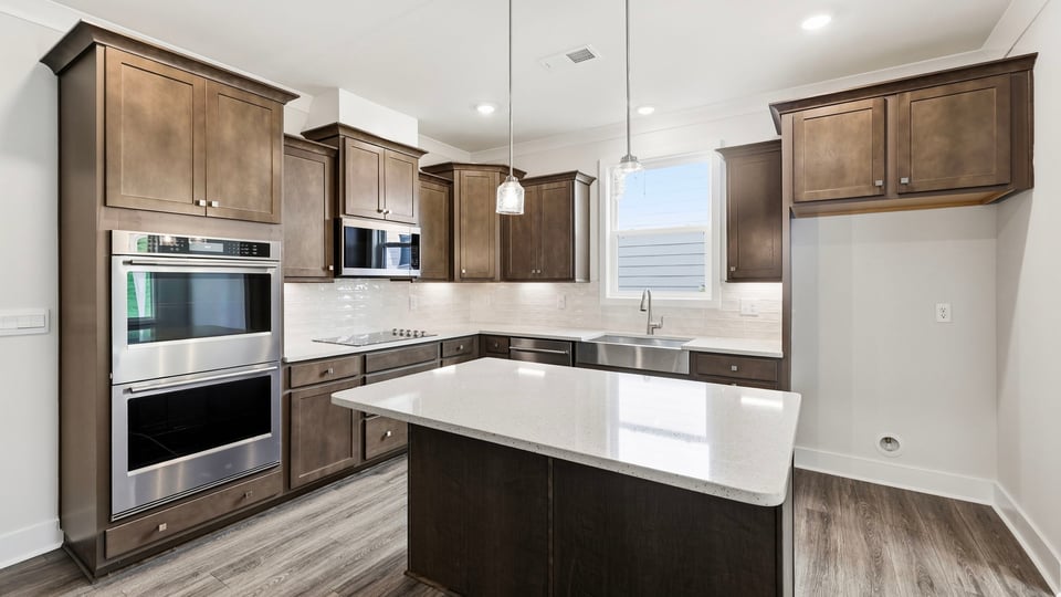 Kitchen with island and cabinets.