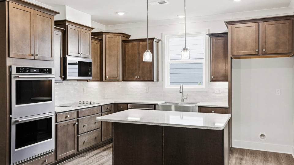 Kitchen with island and cabinets.