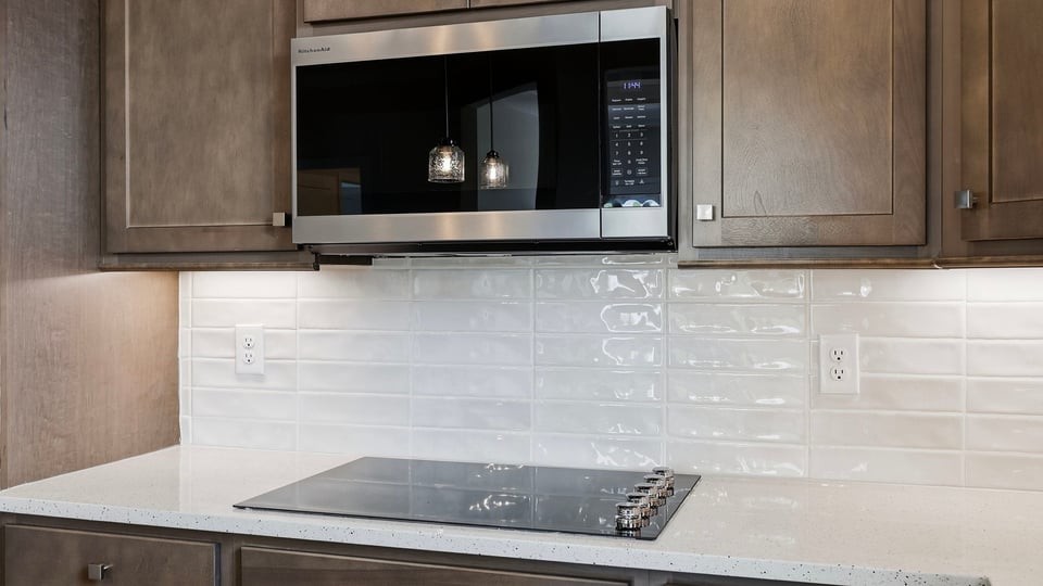 Kitchen with island and cabinets.