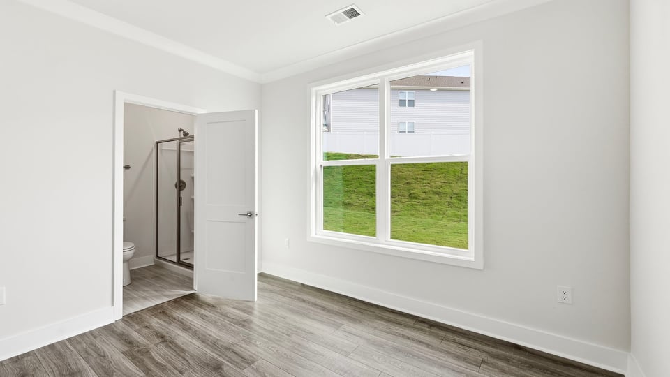 Bedroom with window and closet.