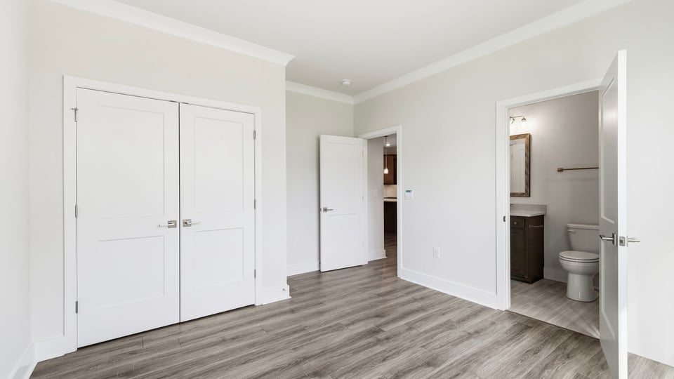 Bedroom with window and closet.