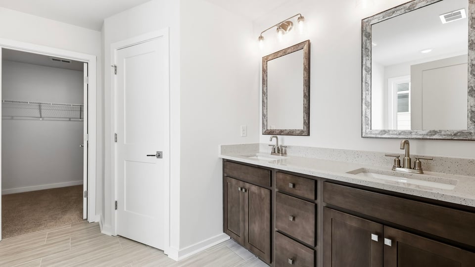 Primary bathroom with double vanity sinks.