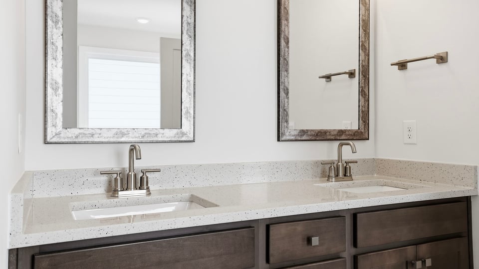 Primary bathroom with double vanity sinks.