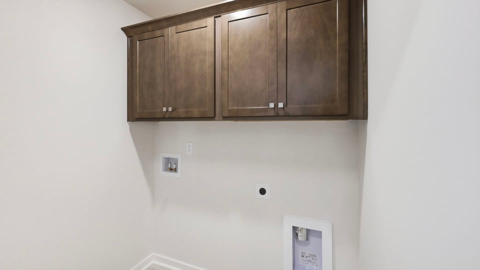 Laundry room with cabinets.