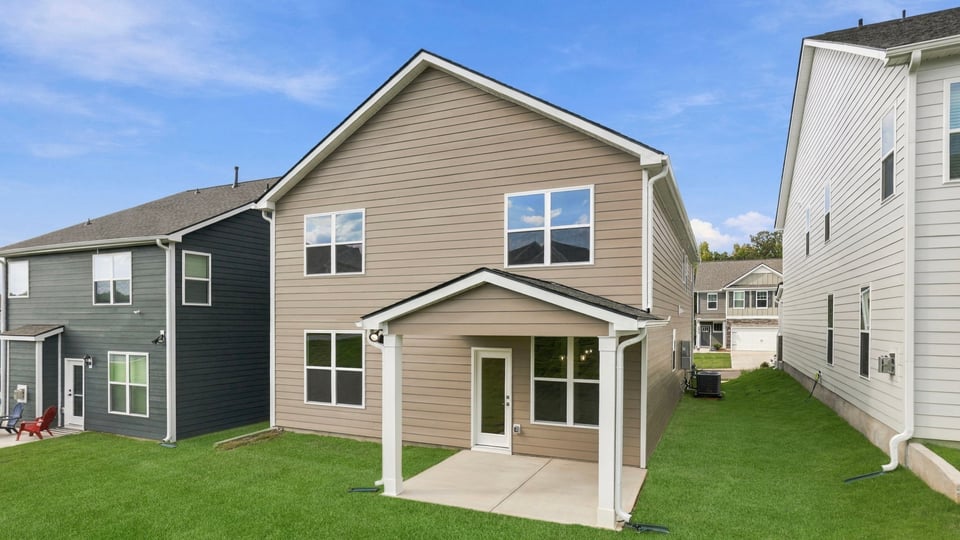 Back exterior with large backyard.