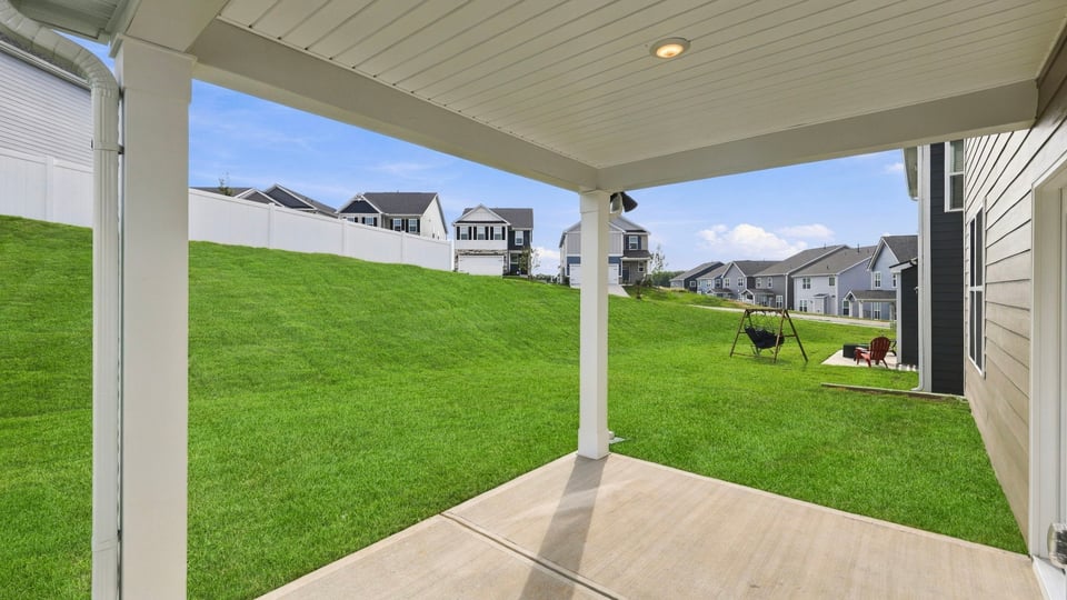 Back exterior with large backyard.