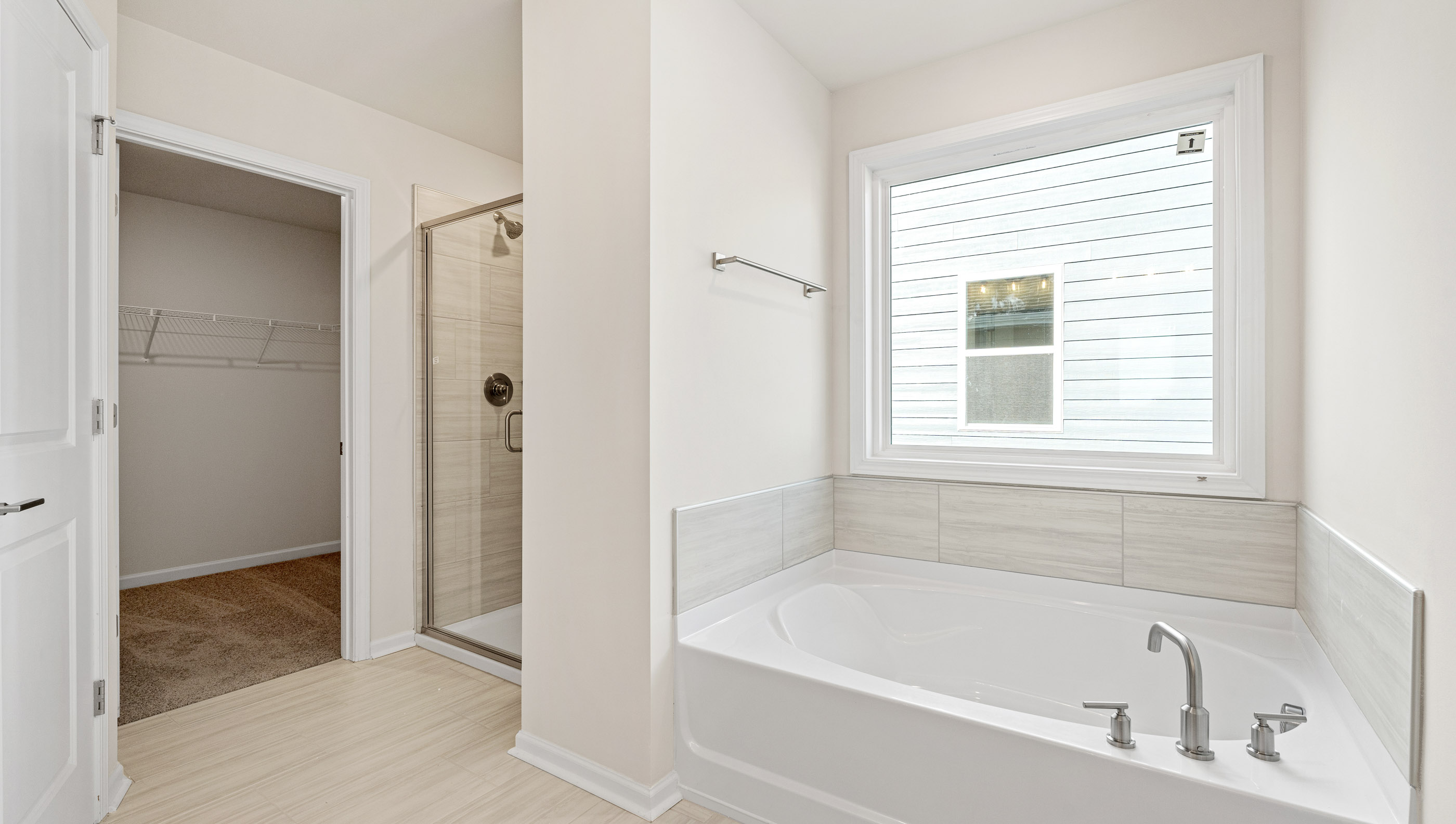 Primary bathroom with double vanity sinks.
