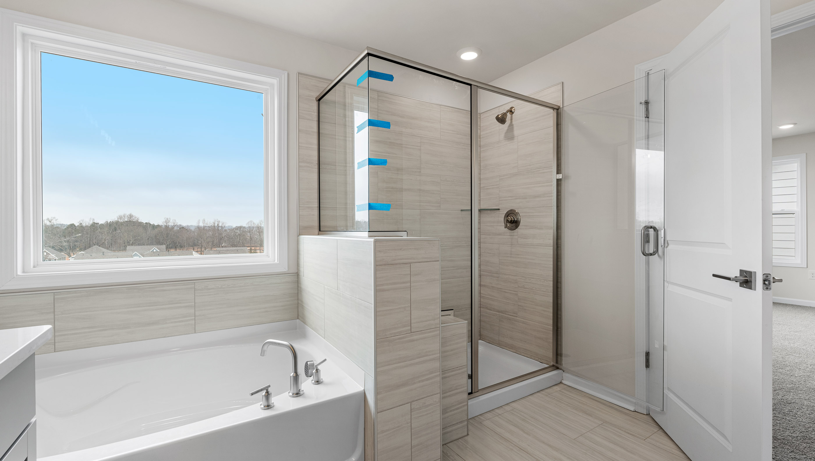 Bathroom with tub and walk in shower.