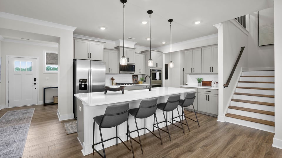 Kitchen with island and cabinets.
