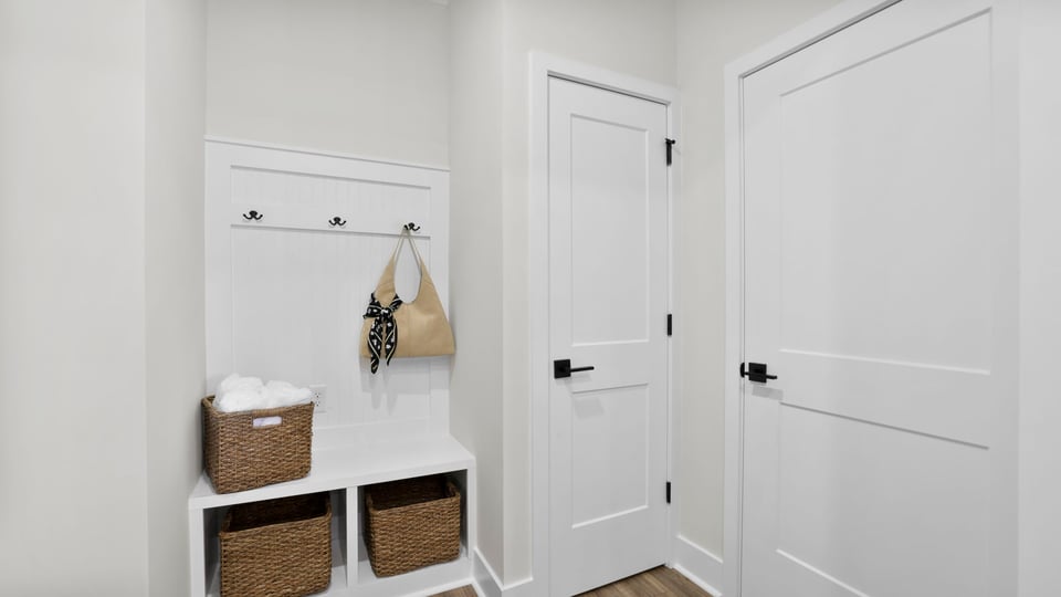 Hallway with storage cabinets.