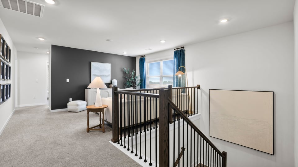 Loft area with carpet.
