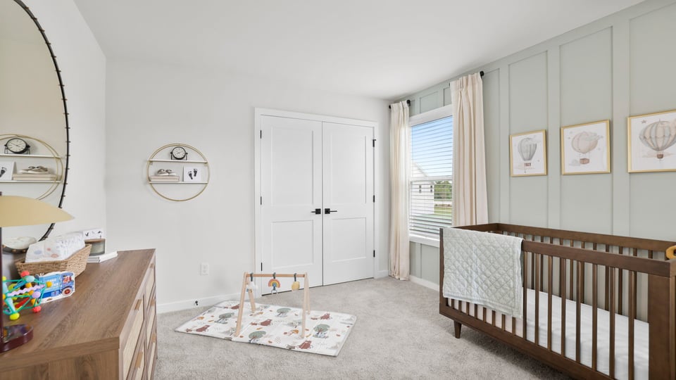 Bedroom with carpet and windows.