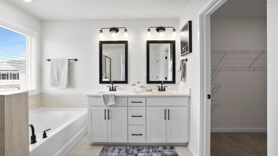 Primary bathroom with double vanity sinks.