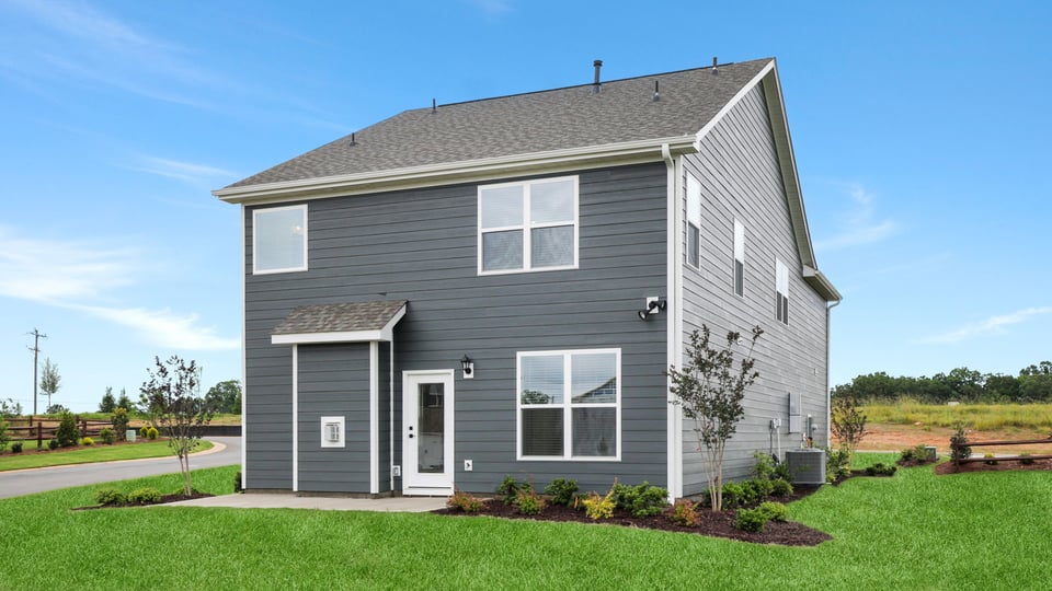 Back exterior with large backyard.