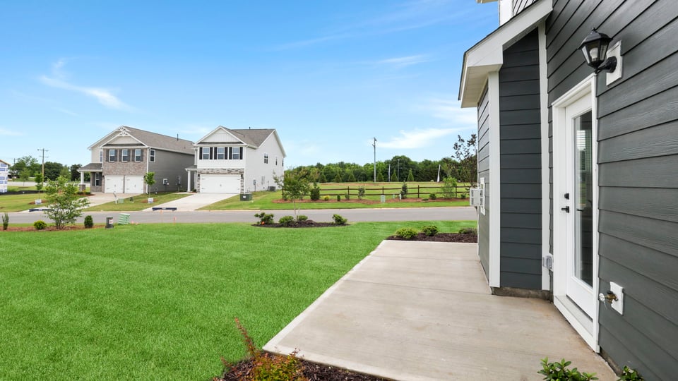 Back exterior with large backyard.