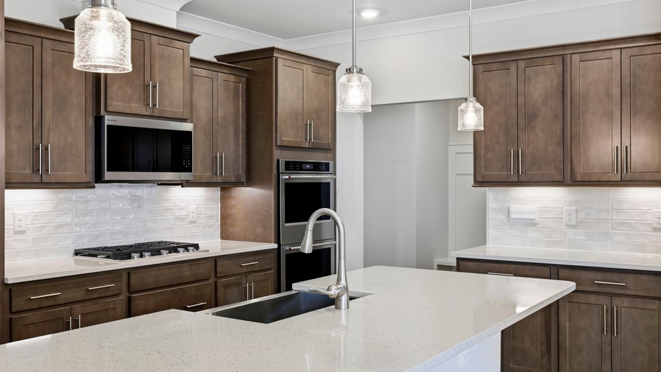 Kitchen with island and cabinets.