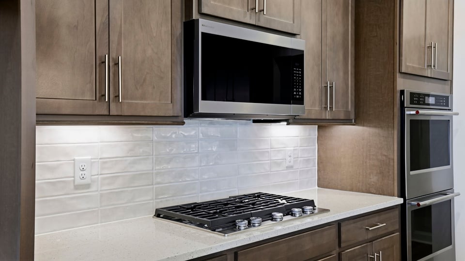 Kitchen with island and cabinets.