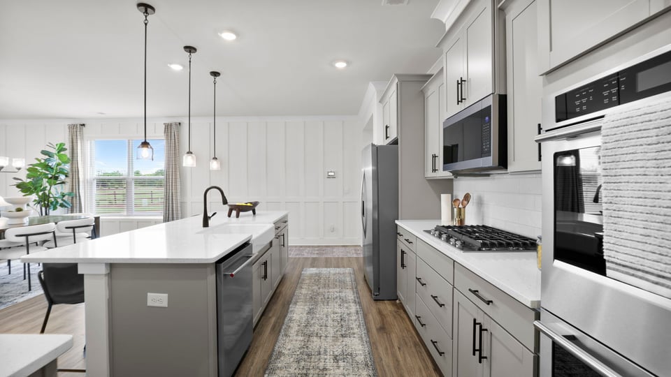 Kitchen with island and cabinets.