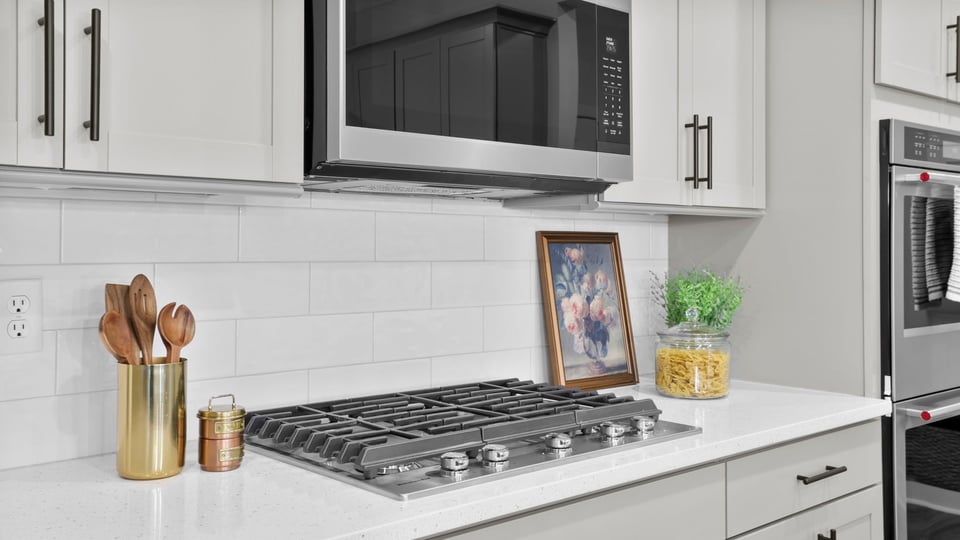Kitchen with island and cabinets.