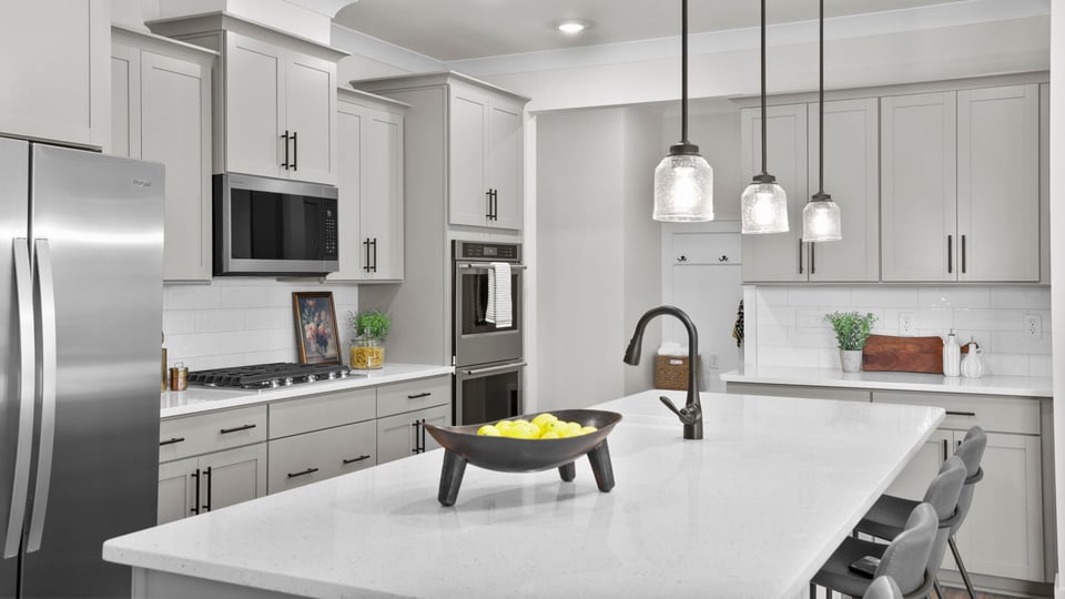 Kitchen with island and cabinets.