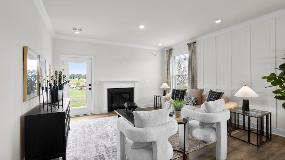 Living area with windows and fireplace.