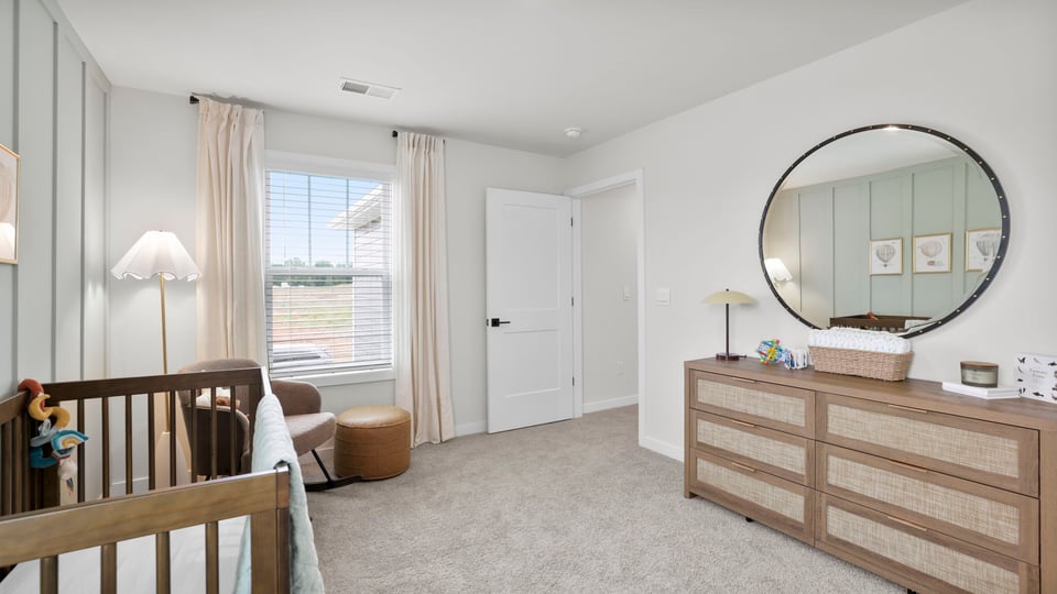 Bedroom with carpet and window.