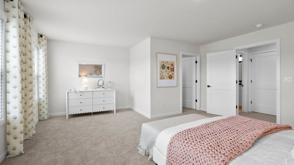 Bedroom with carpet and window.