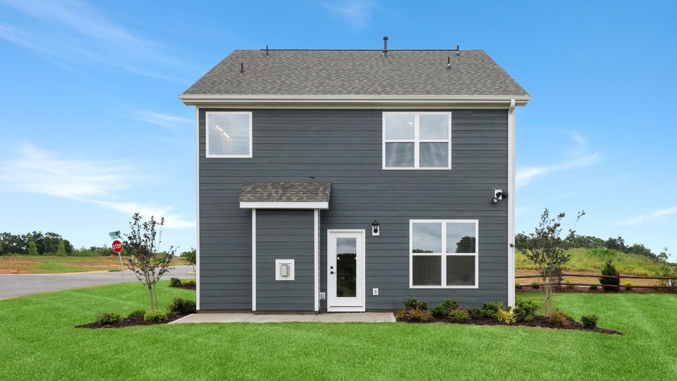 Back exterior with large backyard.