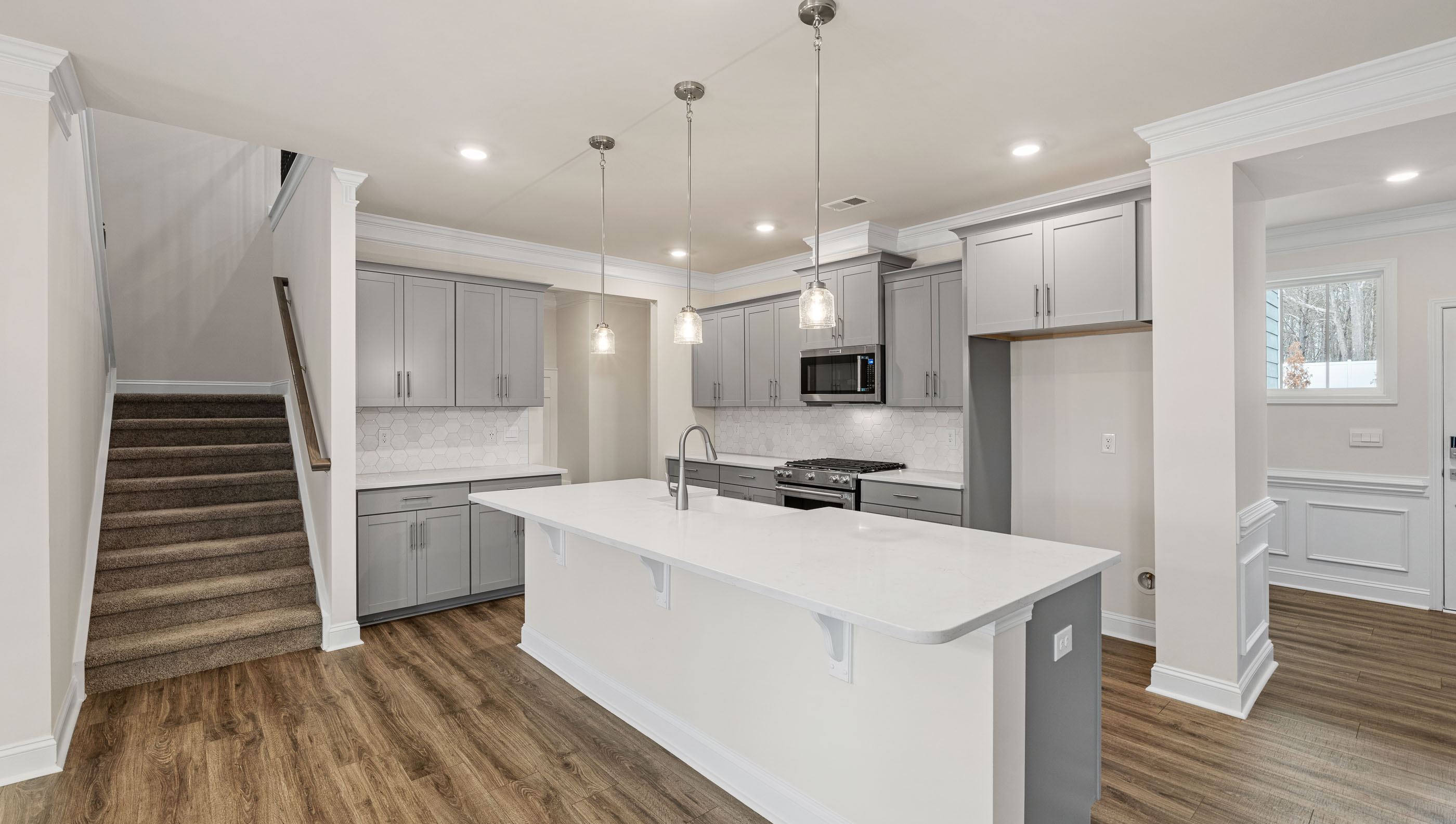 Kitchen with island and cabinets.