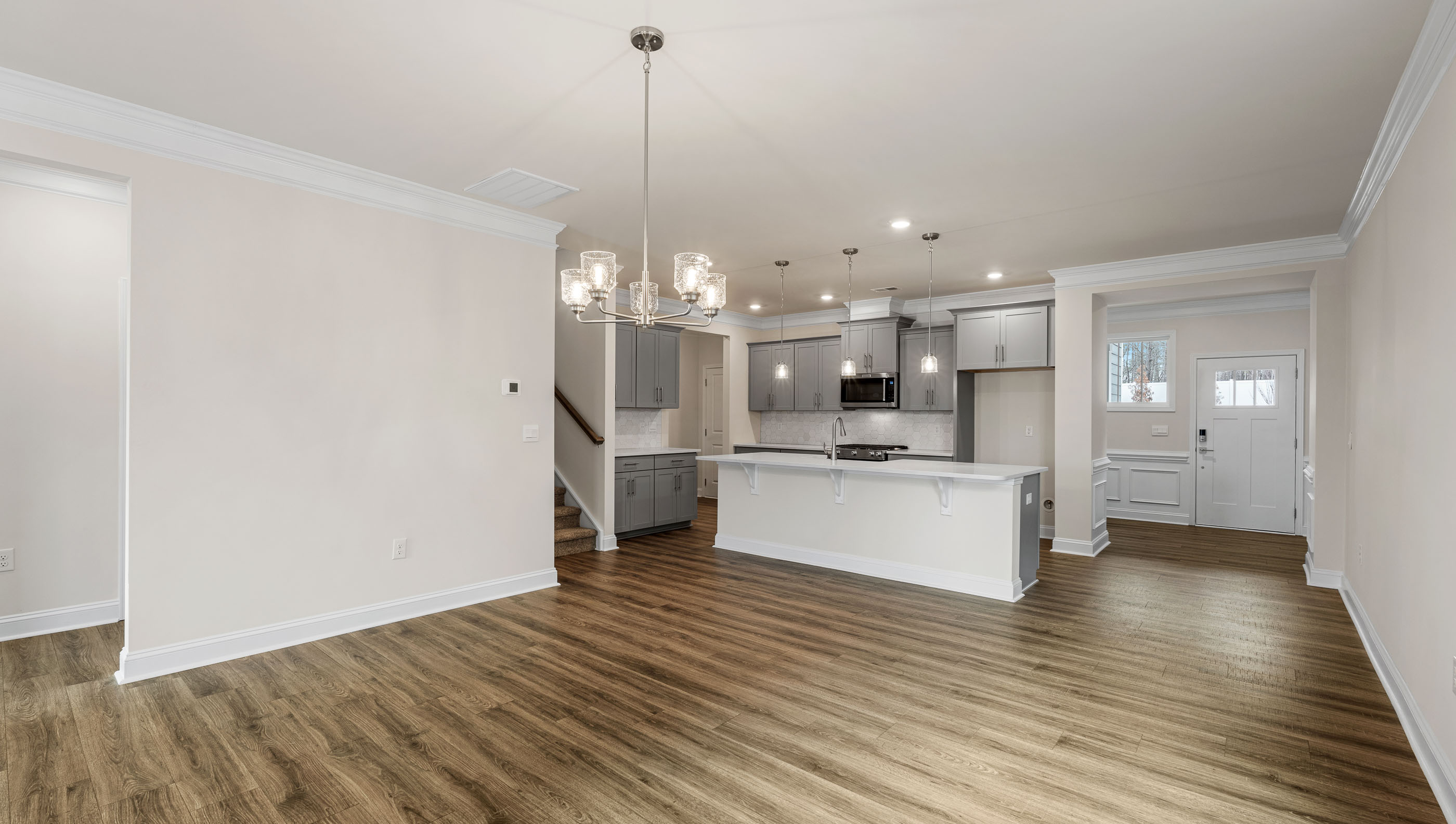 Living area with fireplace and windows.