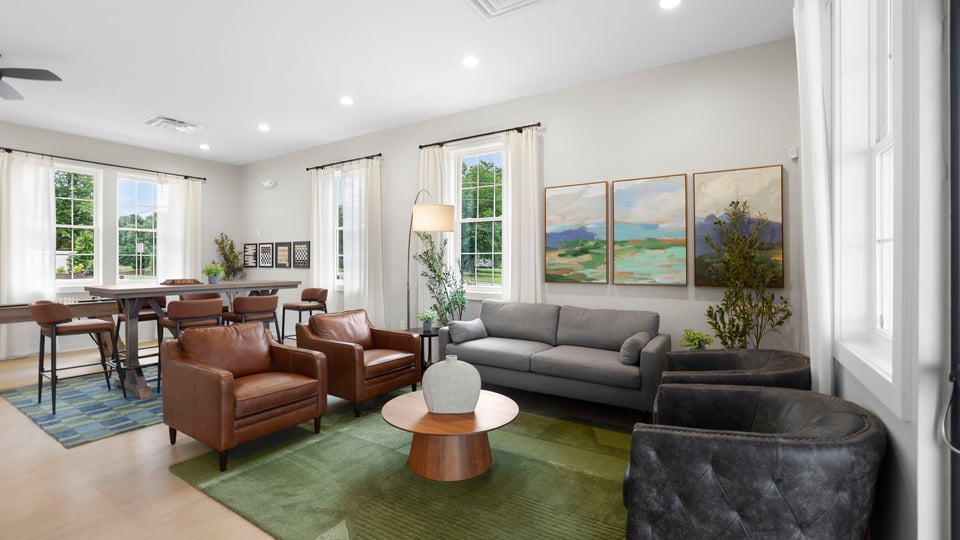 Living area of clubhouse with windows.