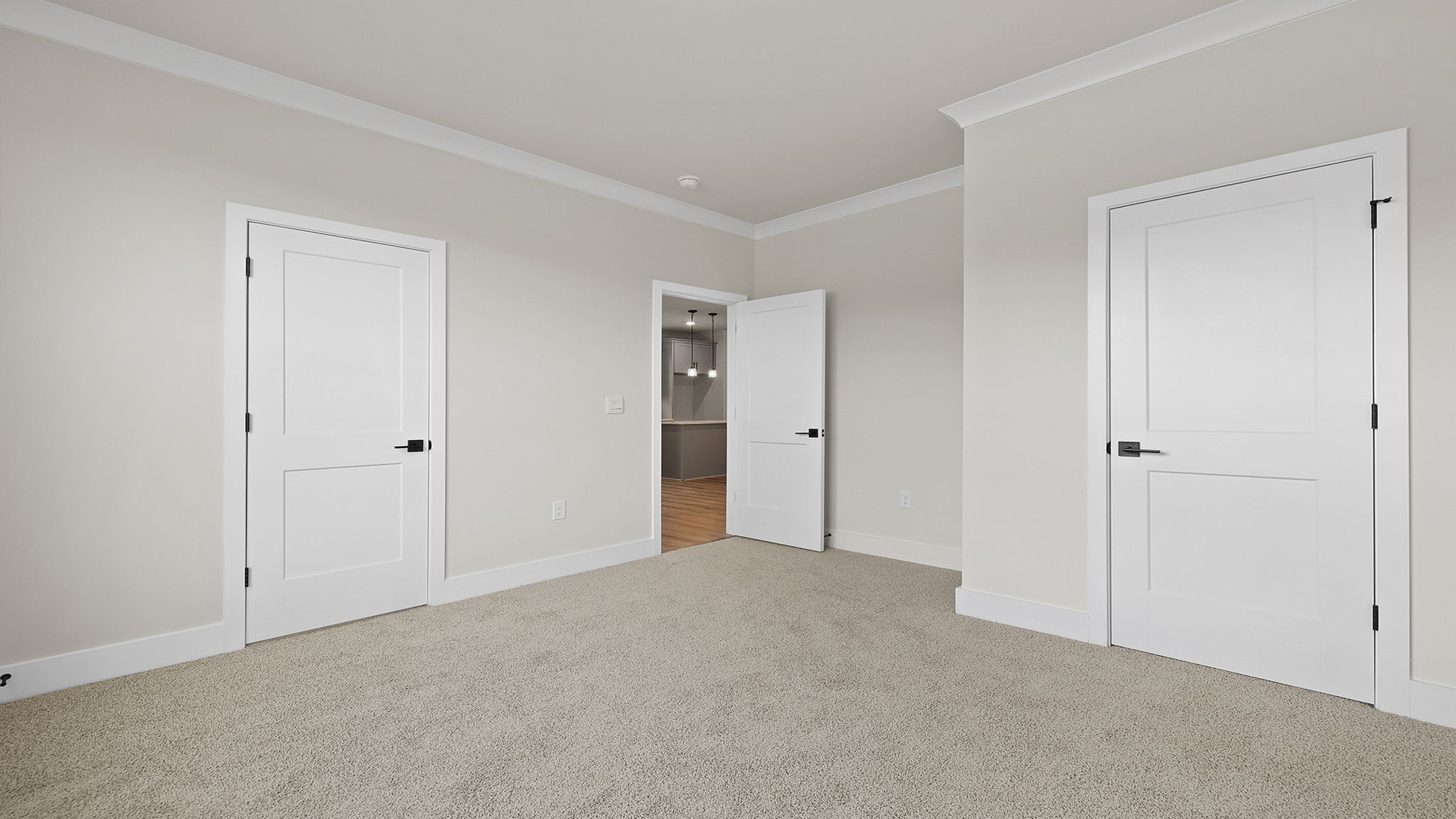 Bedroom with carpet and windows.