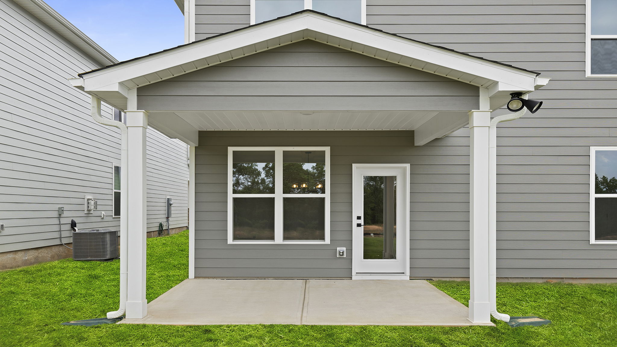 Back exterior with large backyard.