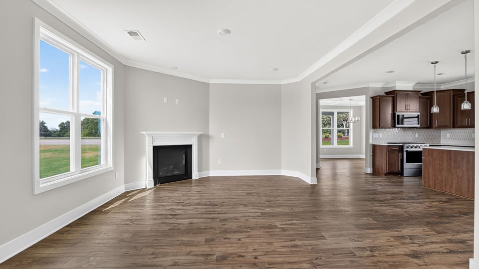 Living area with windows and fireplace.