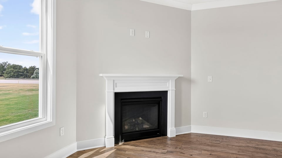 Living area with windows and fireplace.